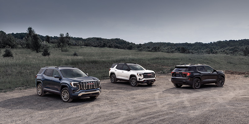 2026 GMC Terrain and 2026 GMC Acadia SUVs side by side, comparing compact and midsize SUV features.